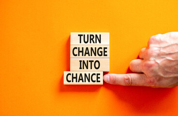 Turn change into chance symbol. Concept words phrase Turn change into chance on beautiful wooden...