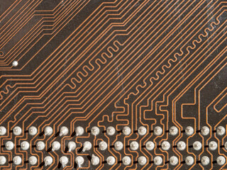 Printed close-up plan under a microscope.Soldering of electronics.Background with electronic tracks.