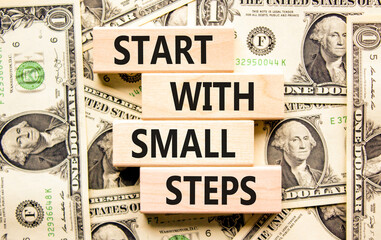 Start with small steps symbol. Concept words phrase Start with small steps on beautiful blocks....