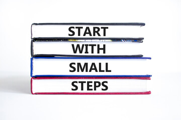 Start with small steps symbol. Concept words phrase Start with small steps on beautiful books....