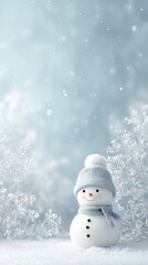 Fototapeta premium Adorable snowman with blue hat and scarf in winter wonderland