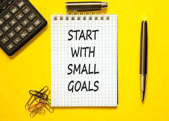 Start with small goals symbol. Concept words phrase Start with small goals on beautiful note. Black...