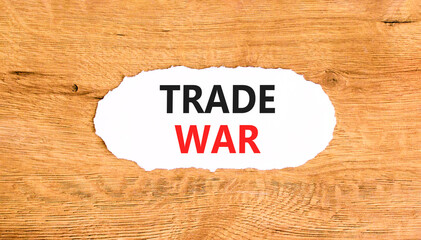 Trade war symbol. Concept word Trade war on beautiful white paper. Beautiful wooden paper...