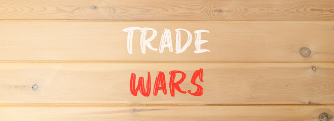 Trade wars symbol. Concept word Trade wars on beautiful wooden wall. Beautiful wooden wall...