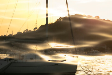Aesthetic seaport background. Harbour with yachts and boats. Double exposure of the ocean and sunset. Abstract design