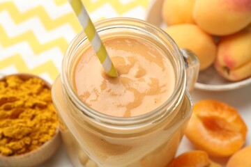 Superfood. Tasty smoothie and ingredients on table, closeup