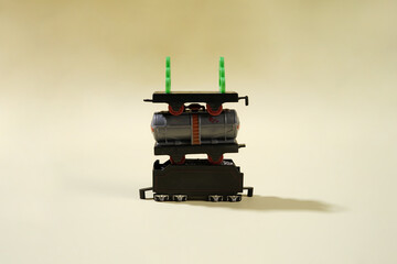 Playful Toy Train with Freight Cars on a Neutral Background