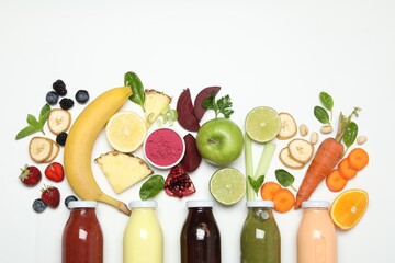 Superfood. Tasty smoothie in glass bottle and ingredients on white background, top view