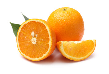 Whole, cut oranges and green leaves isolated on white