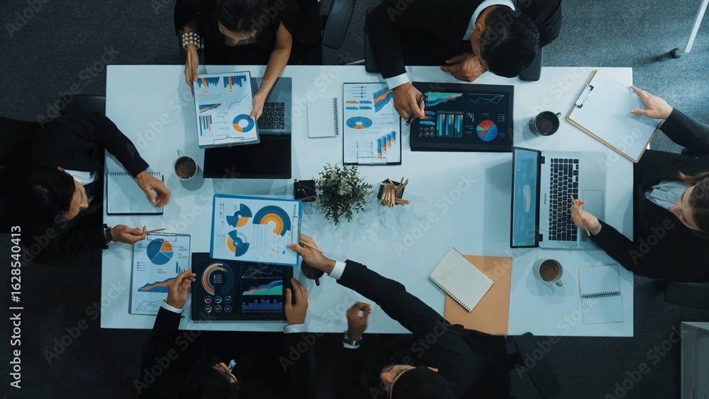 Aufkleber top down aerial view of business people discussing about financial strategy on table with document a