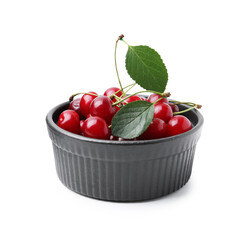 Yummy ripe red cherries in bowl isolated on white