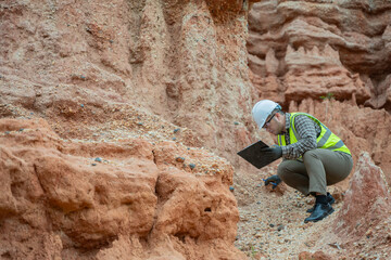 Geologist surveying mine,Explorers collect soil samples to look for minerals, A geologist is a...