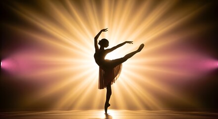 Silhouette of a ballerina gracefully posing en pointe with arms raised against a radiant, starburst-like light background.