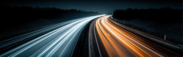 Dynamic light trails illuminate the highway as cars speed by under a dark sky at night