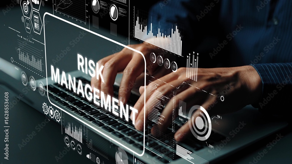 Poster hands typing on laptop with risk management graphics and data visualizations in modern office enviro