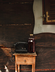 Vintage telephone in an old wood house