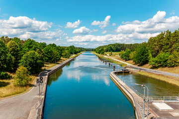 landscape with river. Federal waterway Main-Donau-canal, German: Bundeswasserstraße Main-Donau-Kanal. view from the floodgate Eckersmühlen (Haimpfarrich) Roth, Bavaria, Middle Frankonia, Germany