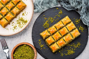 Turkish dessert pistachio baklava on vintage background. Special mini baklava