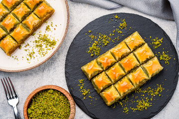 Turkish dessert pistachio baklava on vintage background. Special mini baklava