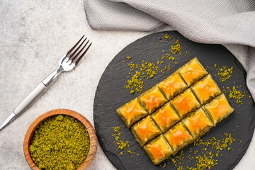 Turkish dessert pistachio baklava on vintage background. Special mini baklava