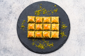 Turkish dessert pistachio baklava on vintage background. Special mini baklava