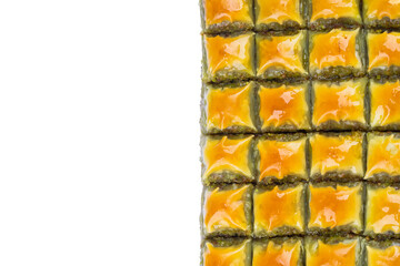 Turkish dessert pistachio baklava on white background. Special mini baklava