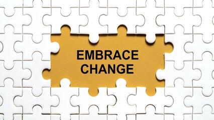 Conceptual image of a missing puzzle piece showing the text 'EMBRACE CHANGE' on a yellow background.	