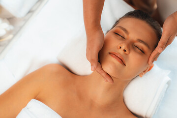 Panorama top view of woman enjoying relaxing anti-stress head massage and pampering facial beauty...
