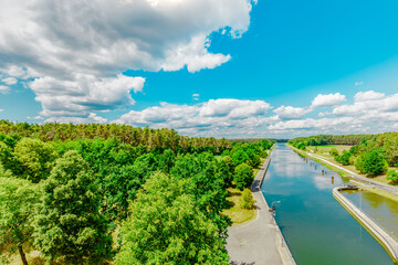 landscape with river. Federal waterway Main-Donau-canal, German: Bundeswasserstraße Main-Donau-Kanal. view from the floodgate Eckersmühlen (Haimpfarrich) Roth, Bavaria, Middle Frankonia, Germany