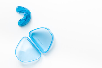 Orthodontic appliance for correction of teeth with a box on white background. Dental mouth guard