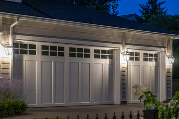 Garage door in luxury house with trees and nice landscape in Spring in Vancouver, Canada, North...