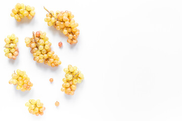 Many fresh green grape clusters isolated on white background.