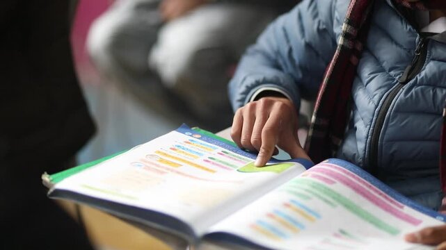 Student reading book