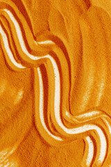 Lines and details of yellow sand texture background, close up top view. Abstract sand surface
