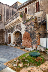 Realistic view of historical streets of Catania, Sicily, facade of old buildings. Winer time
