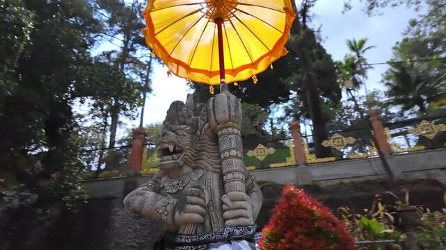 Stone Daemon in ancient Pura Tirta Empul Temple on Bali, Indonesia