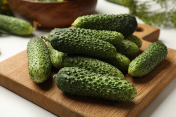 Making pickles. Fresh cucumbers on white table, closeup