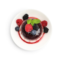 Tasty panna cotta with berries and jam isolated on white, top view