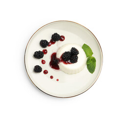 Tasty panna cotta with blackberries, mint and sauce isolated on white, top view