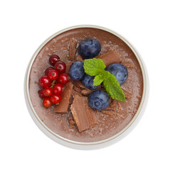 Delicious panna cotta with chocolate, berries and mint isolated on white, top view