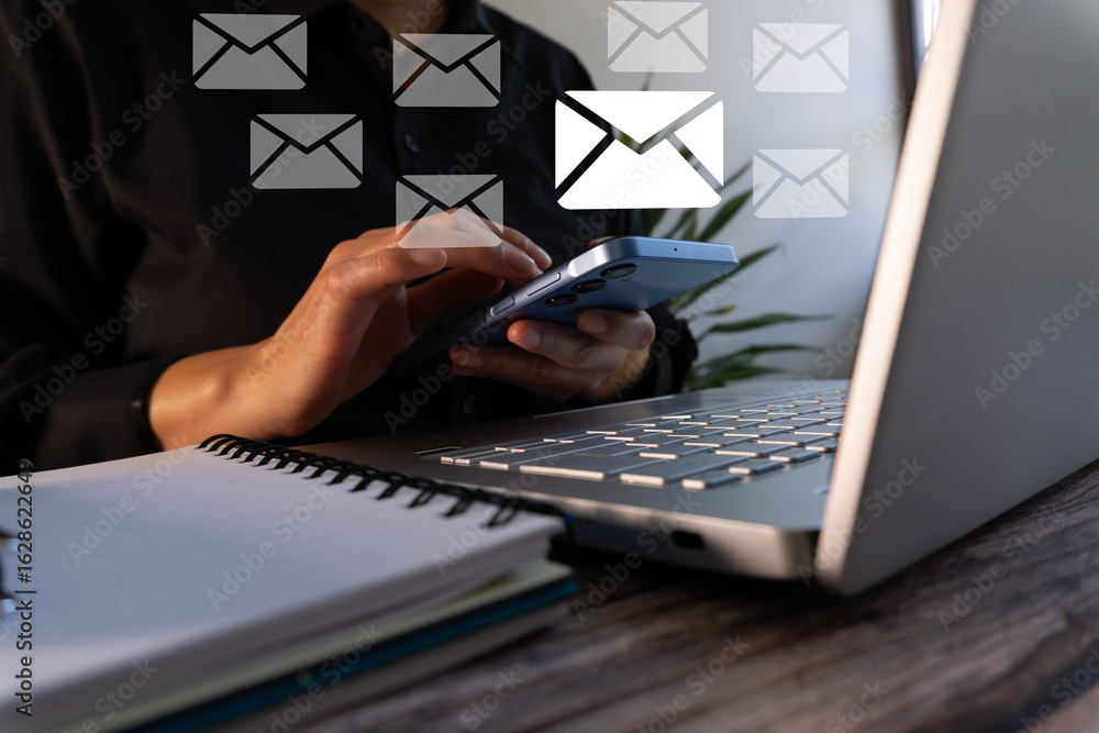 Poster a person with a cell phone and a computer with several email icons around it