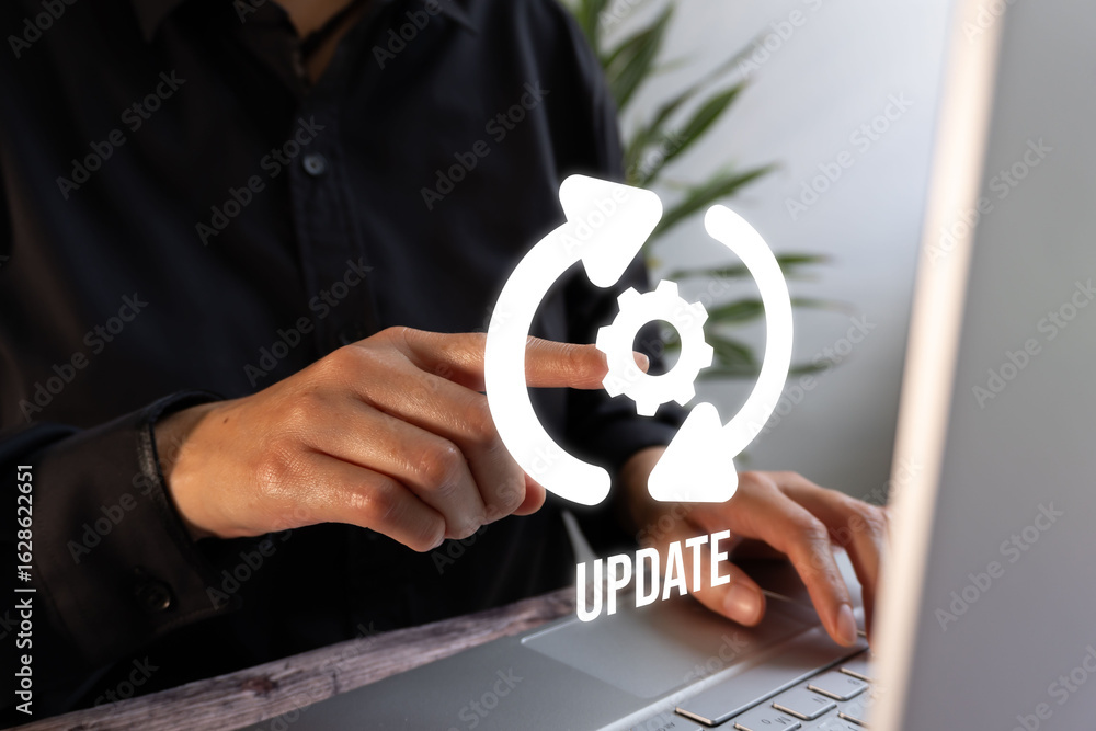 Poster software update: a person in front of a computer with arrows and a gear with the word 