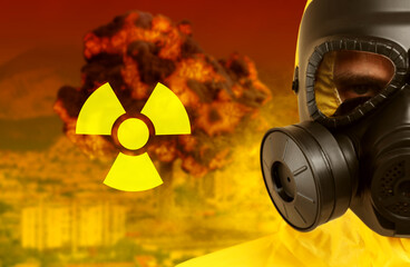 Radioactive hazard, warning sign. Man in hazmat suit and gas mask. Explosion in city