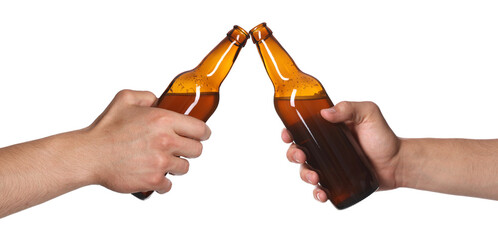 Men clinking their bottles of beer together against white background