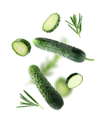 Fresh cucumbers and rosemary falling against white background
