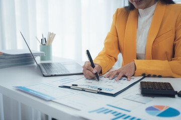 The Art of Precision: An accountant meticulously reviews financial documents in a well-lit office....