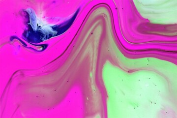 Colorful abstract background of acrylic paint in pink and purple tones.