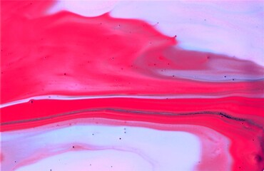Red and pink paint mixing in water. Abstract background for design.