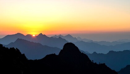 Sunrise Over Distant Mountain Range with Orange Sky