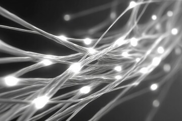 Illuminated threads create an abstract light display in a dark setting during evening hours